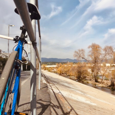 a bike leaned against railing